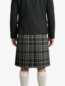 Person wearing a black coat and gray plaid kilt on a white background