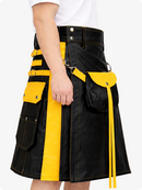 Black kilt with yellow accents worn by a person on a white background
