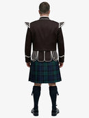 Person wearing a traditional Scottish black watch tartan kilt with a dark brown jacket on a white background