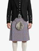 Person wearing a traditional Scottish kilt with a decorative buckle on a white background