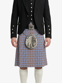 Person wearing a traditional Scottish kilt with a decorative buckle on a white background