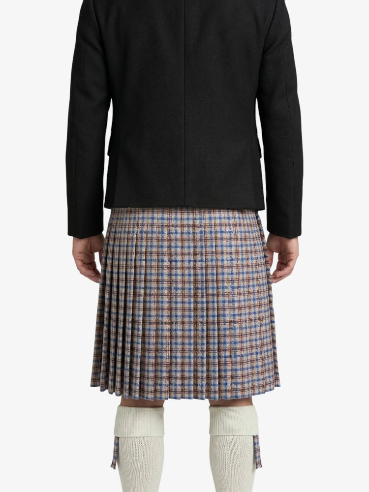 Person wearing a black jacket and plaid kilt on a white background