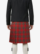 Person wearing a black jacket and red plaid kilt on a white background
