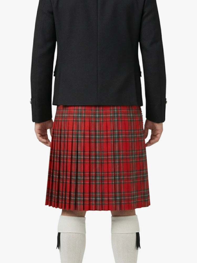 Person wearing a black jacket and red plaid kilt on a white background