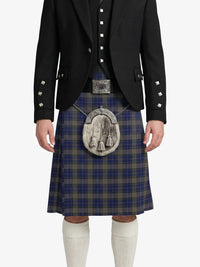 Person wearing a traditional Scottish kilt with a jacket on a white background