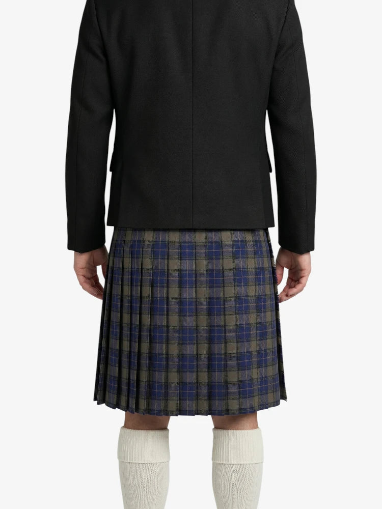 Person wearing a black jacket and plaid kilt on a white background