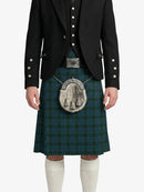 Person wearing a traditional Scottish kilt with a jacket on a white background