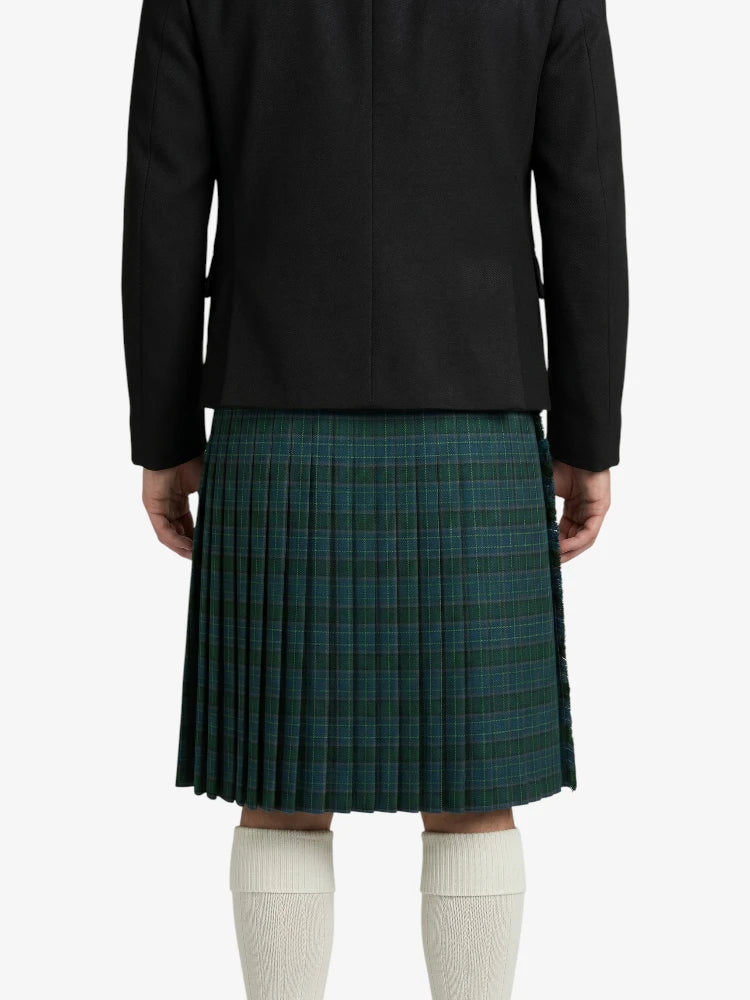 Person wearing a black coat and green plaid kilt on a white background