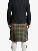 Person wearing a black jacket and plaid kilt on a white background