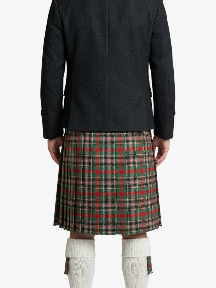 Person wearing a black jacket and plaid kilt on a white background