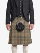 Traditional Scottish kilt with a dark jacket on a white background