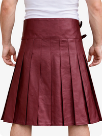 Burgundy pleated skirt worn by a person on a white background