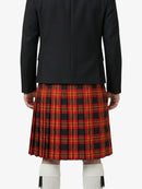 Person wearing a black jacket and red plaid kilt on a white background
