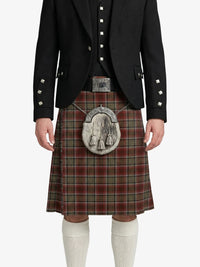 Person wearing a black jacket and red plaid kilt with a silver sporran on a white background