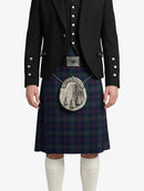 Person wearing a traditional Scottish kilt with a jacket on a white background