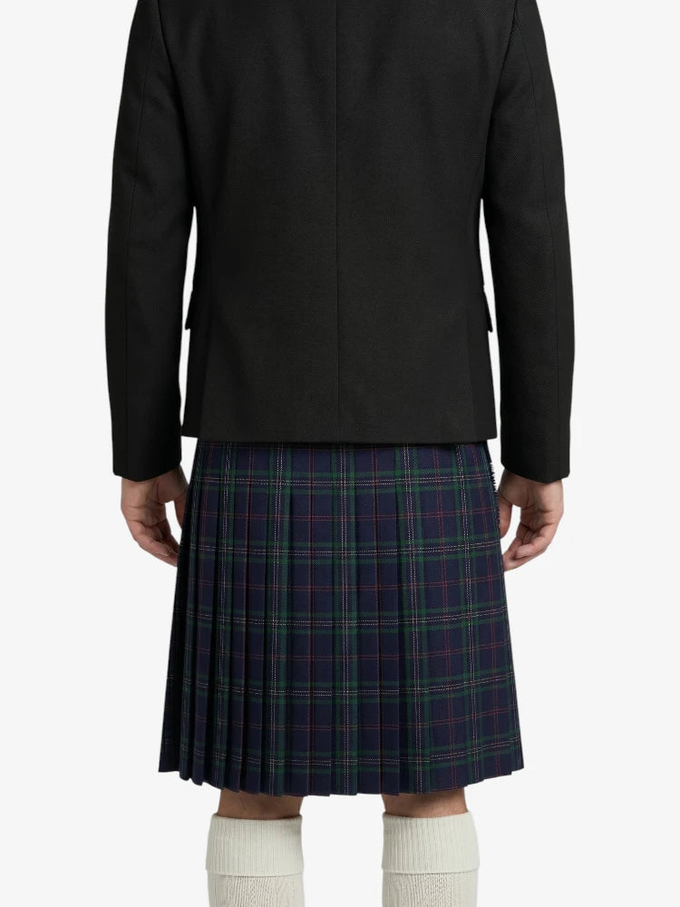 Person wearing a black jacket and plaid kilt on a white background