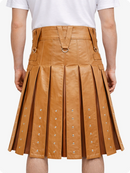 Camel pleated leather skirt with silver studs on a white background