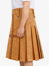 Camel kilt with decorative studs on a white background