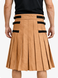 Camel pleated skirt with black straps worn by a person on a white background