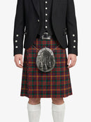 Person wearing a black jacket, red plaid kilt, and white socks on a white background