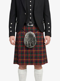 Person wearing a black jacket, red plaid kilt, and white socks on a white background