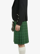 Person wearing a black jacket and green plaid kilt on a white background