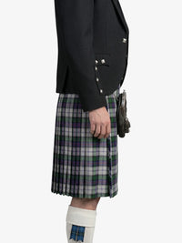Person wearing a black jacket and plaid kilt on a white background
