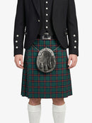 Person wearing a black jacket and green plaid kilt with a silver sporran on a white background