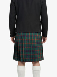 Person wearing a black jacket and green plaid kilt on a white background