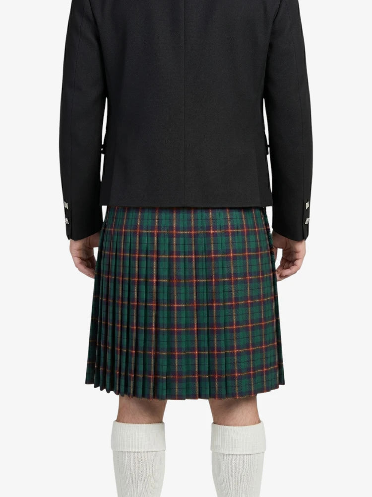 Person wearing a black jacket and green plaid kilt on a white background