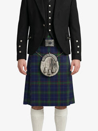 Person wearing a traditional Scottish kilt with a jacket on a white background