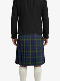 Person wearing a black jacket and blue plaid kilt on a white background