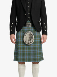 Person wearing a traditional Scottish kilt with a jacket on a white background
