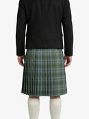 Person wearing a green plaid kilt with a black jacket on a white background