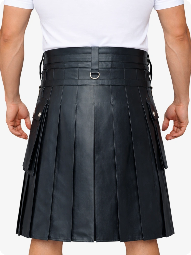 Black pleated kilt worn by a person on a plain background