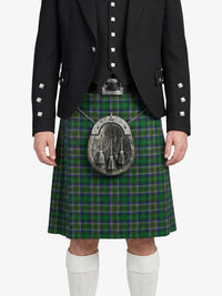 Person wearing a black jacket and green plaid kilt on a white background