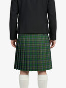 Person wearing a black jacket and green plaid kilt on a white background