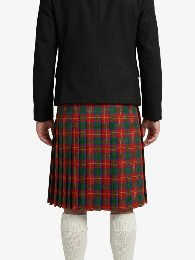 Person wearing a black jacket and red plaid kilt on a white background