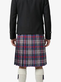 Person wearing a black jacket and plaid kilt on a white background