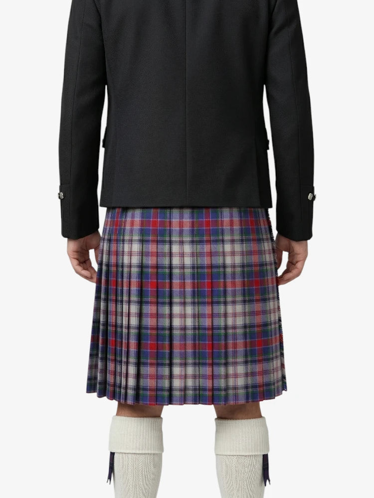 Person wearing a black jacket and plaid kilt on a white background