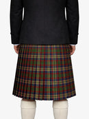 Person wearing a black jacket and plaid kilt on a white background