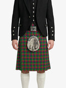 Person wearing a traditional Scottish kilt with a prominent tartan pattern on a white background