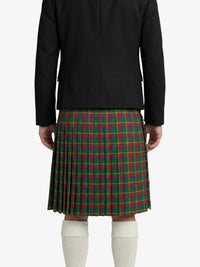 Person wearing a black jacket and green plaid kilt on a white background