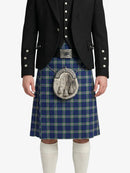 Person wearing a traditional Scottish kilt with a jacket on a white background