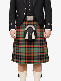 Person wearing a traditional Scottish kilt with a tartan pattern on a white background