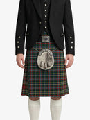 Person wearing a Scottish kilt with a tartan pattern on a white background