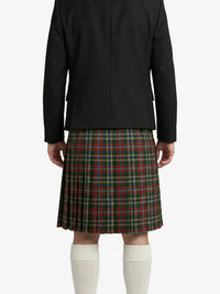 Person wearing a black jacket and plaid kilt on a white background