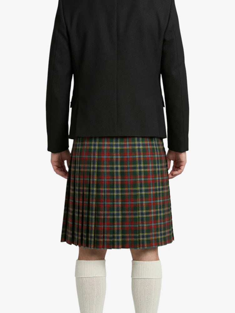 Person wearing a black jacket and plaid kilt on a white background