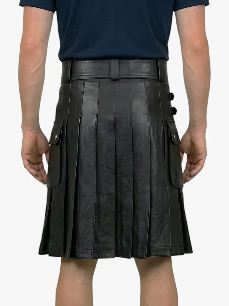 Person wearing a black leather kilt on a white background