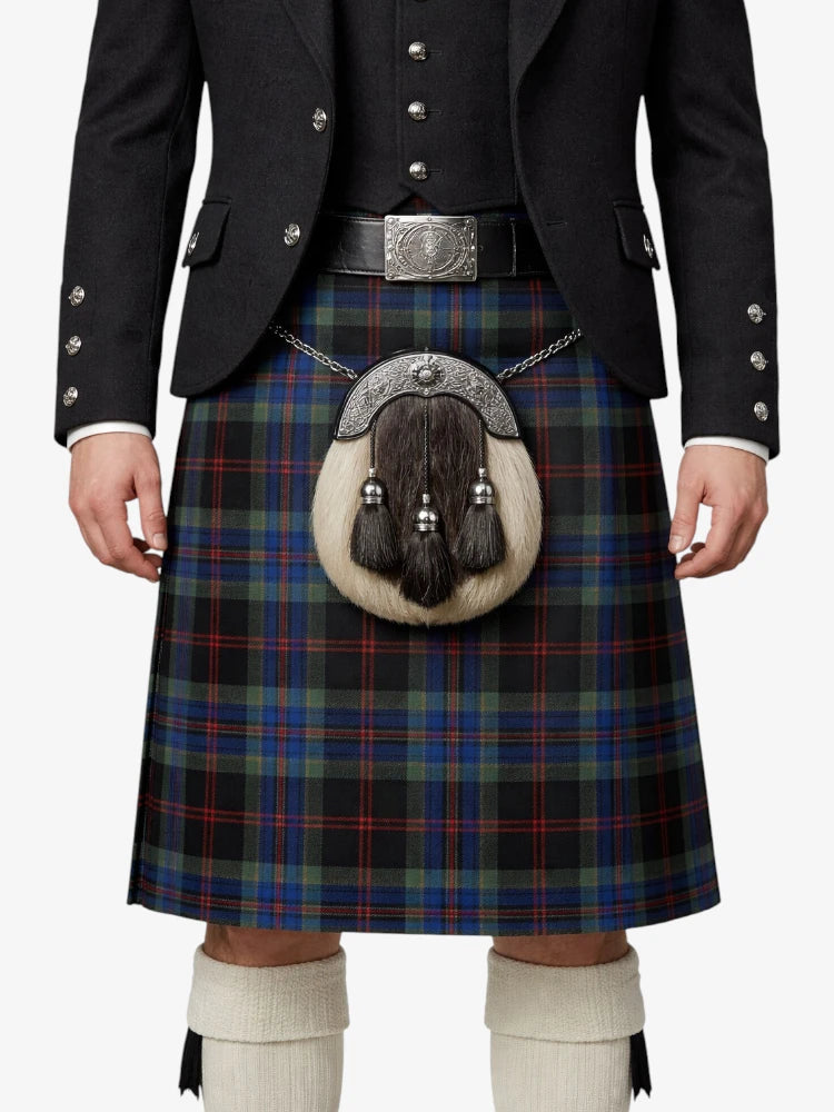 Person wearing a traditional Scottish kilt with a jacket and white knee-high socks on a white background
